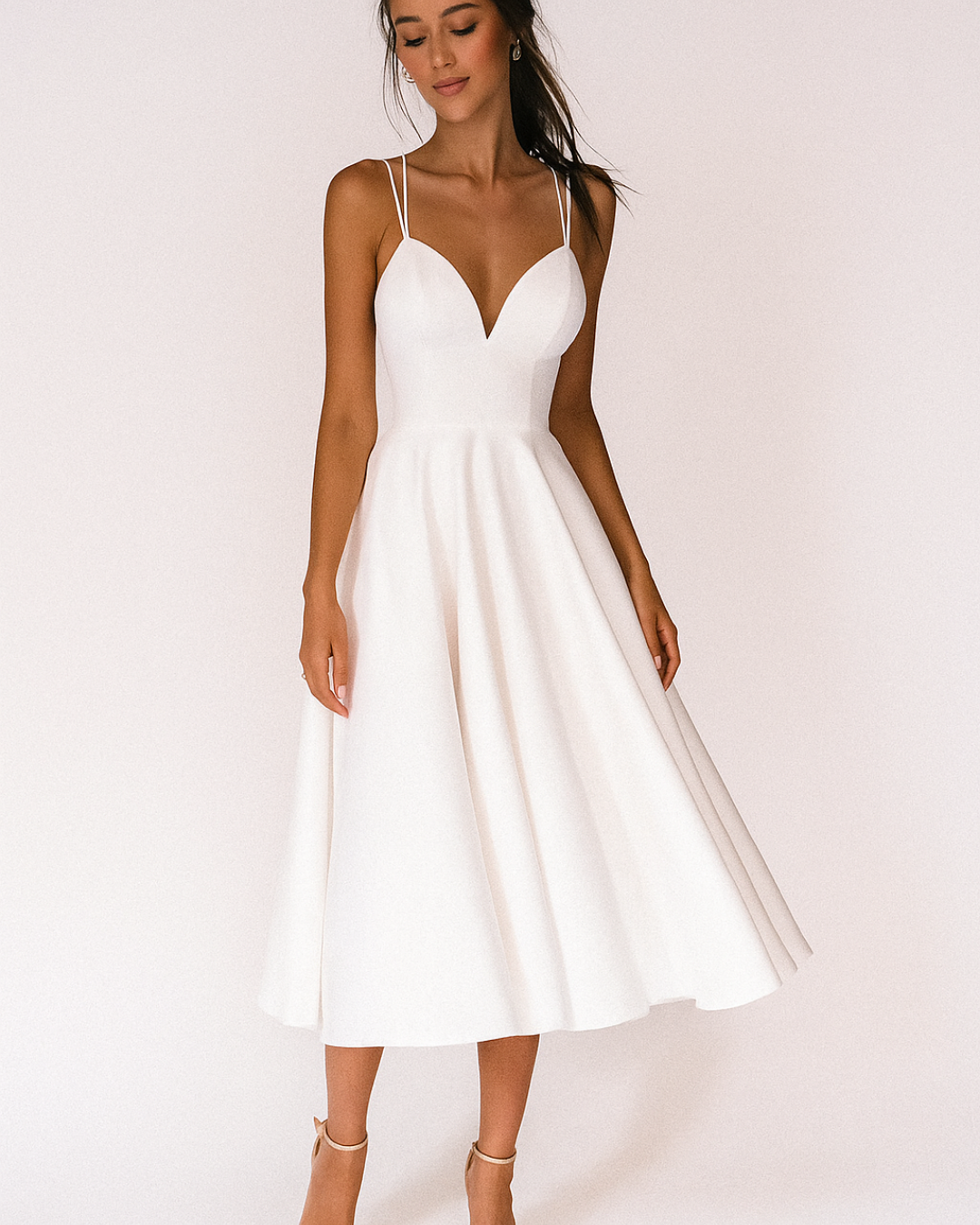 White sweetheart neckline midi dress with double spaghetti straps and flared skirt