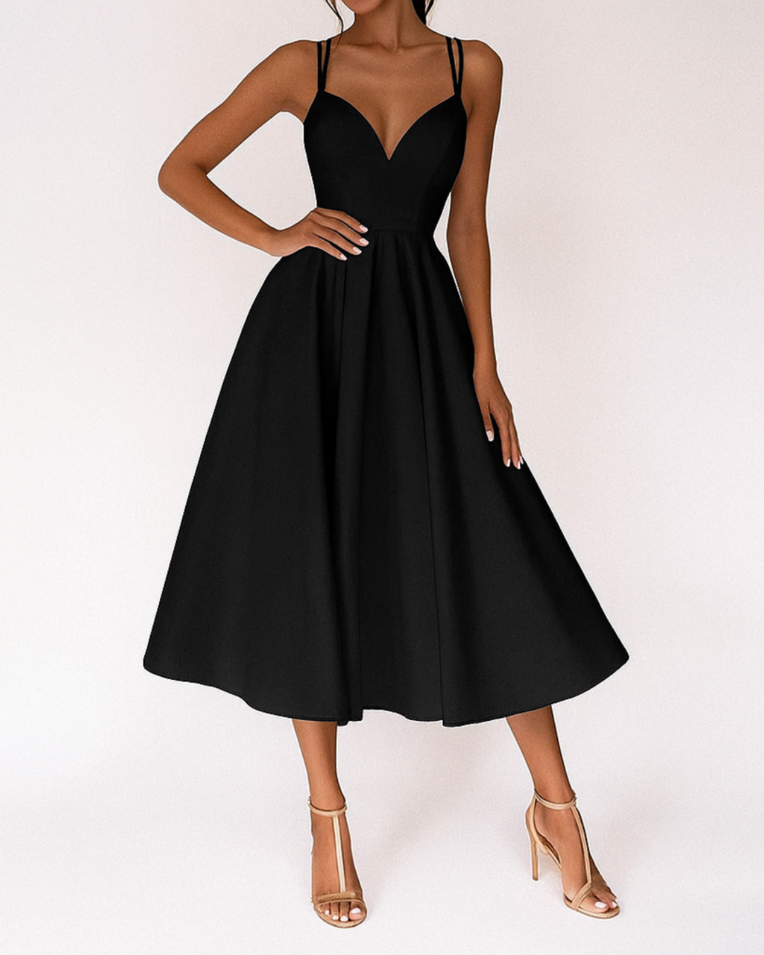 Black sweetheart neck midi dress with double straps paired with nude heels