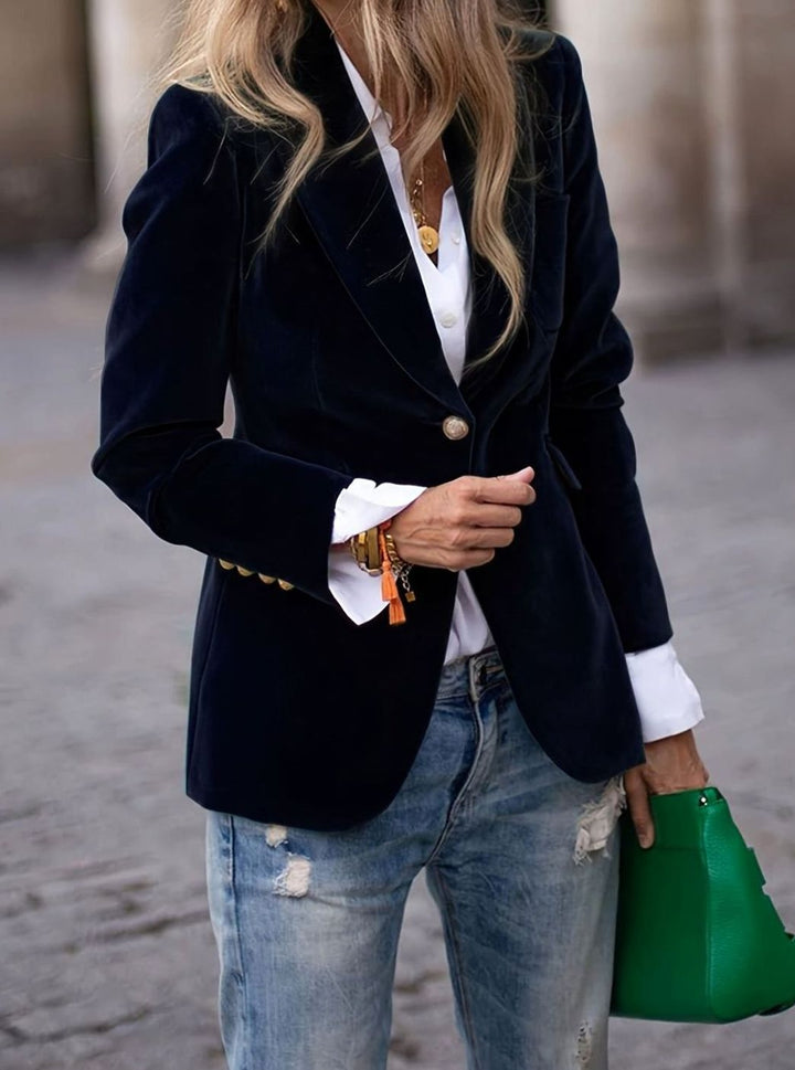 Navy velvet single-button blazer layered over white shirt and jeans