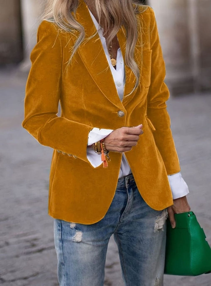 Mustard yellow velvet single-button blazer styled with white shirt and jeans