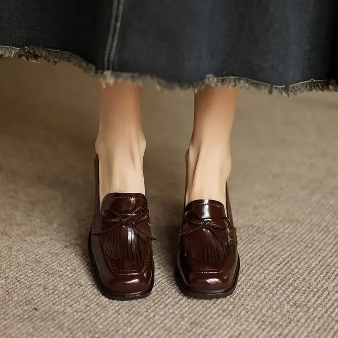 back view of brown patent leather block heel loafer pump