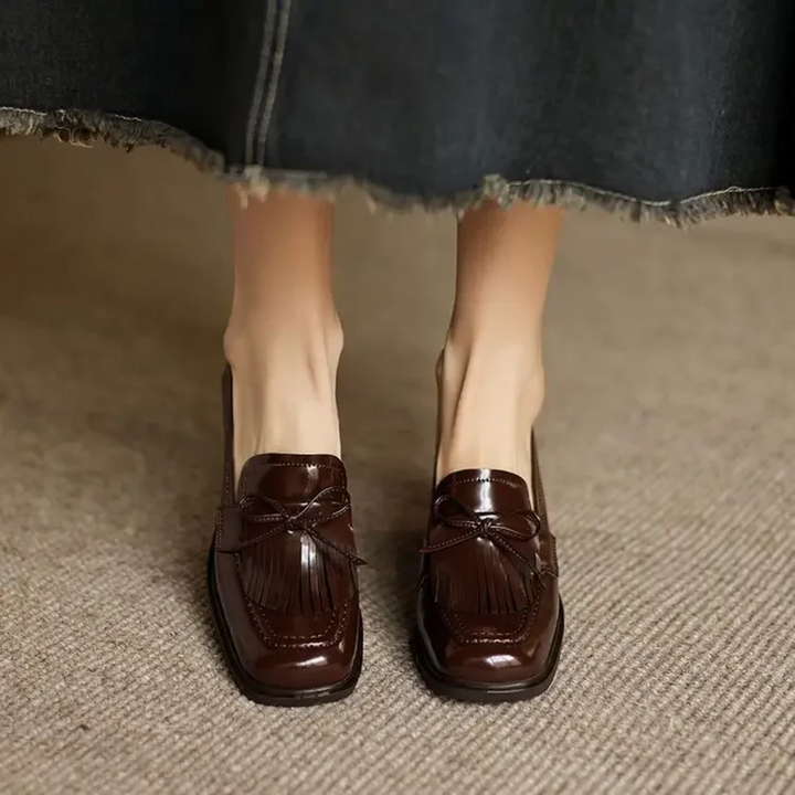 back view of brown patent leather block heel loafer pump