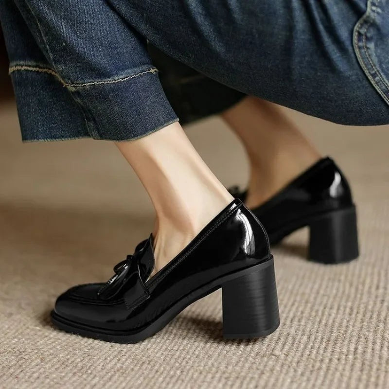black patent leather block heel loafers styled with cropped denim