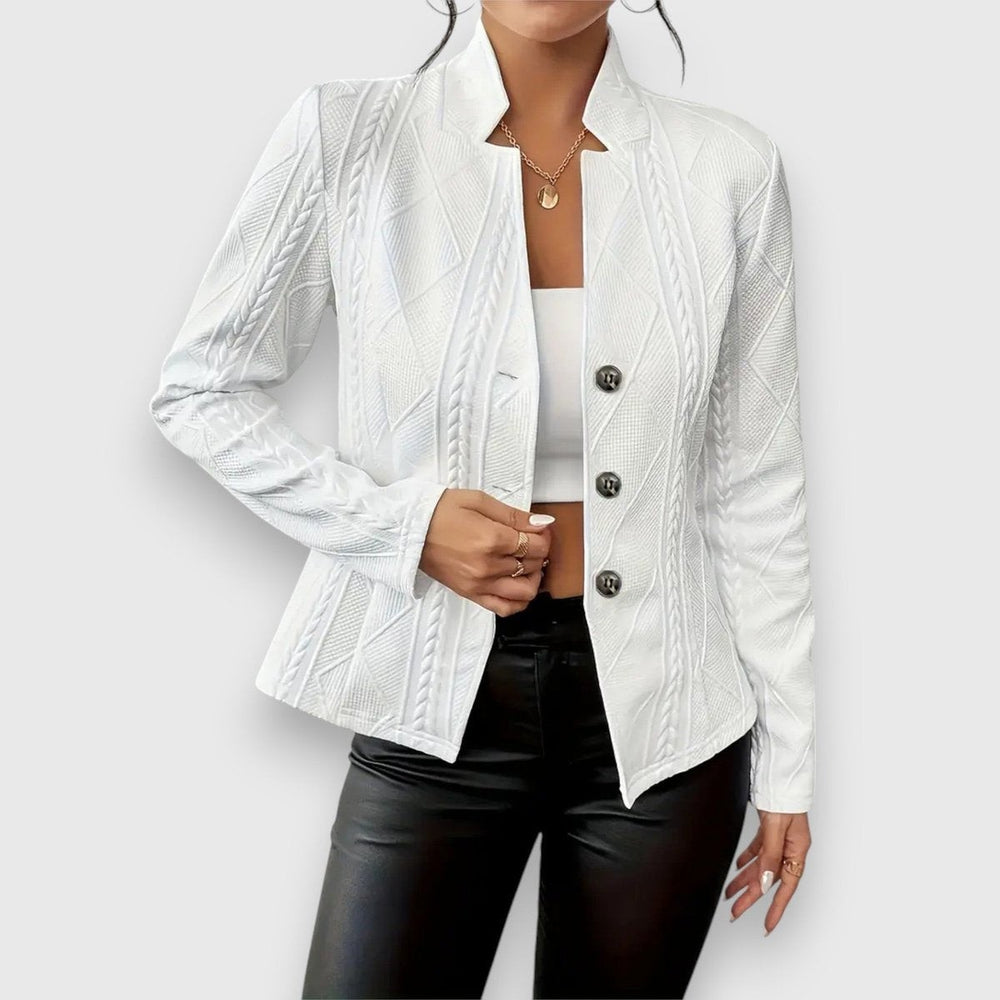 white cable-knit textured jacket styled with black leather pants