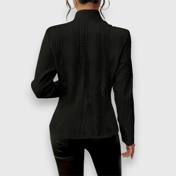 black cable-knit fitted jacket with mock neck, back view