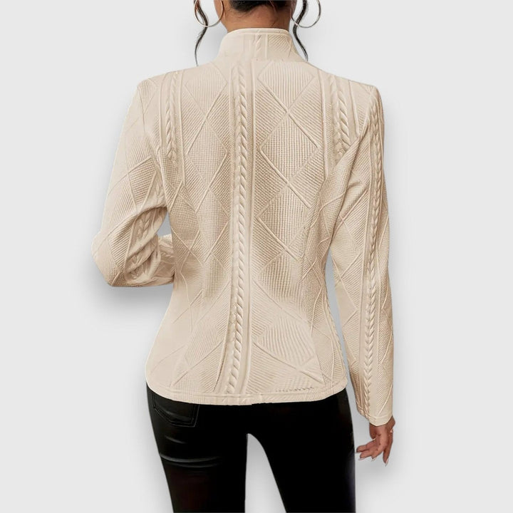 beige cable-knit fitted jacket with mock neck, back view