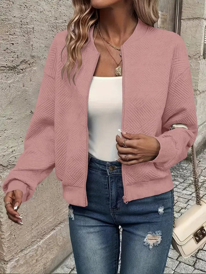 Pink quilted cropped bomber jacket with diamond stitch detail