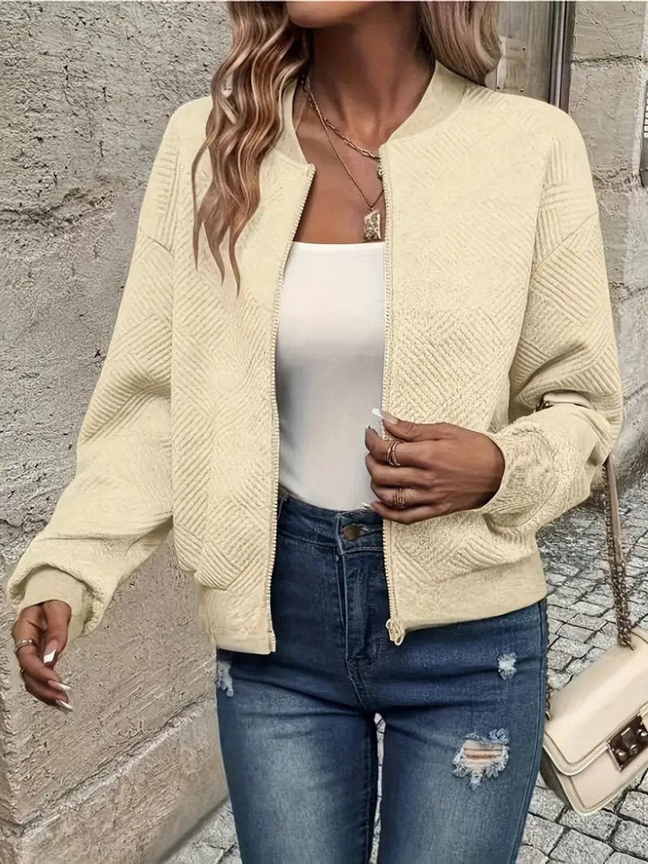 Cream textured zip-up bomber jacket with woven diamond pattern