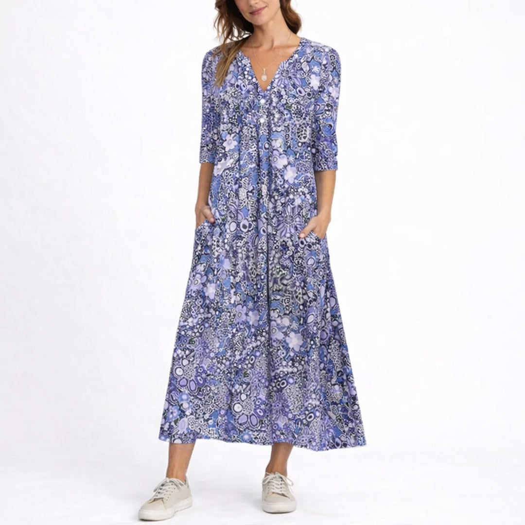 purple floral midi dress with V-neck and three-quarter sleeves on model