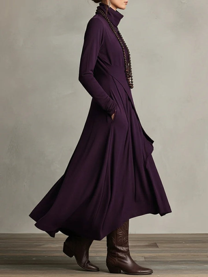 Side profile of purple long sleeve maxi dress showing draped asymmetric layers