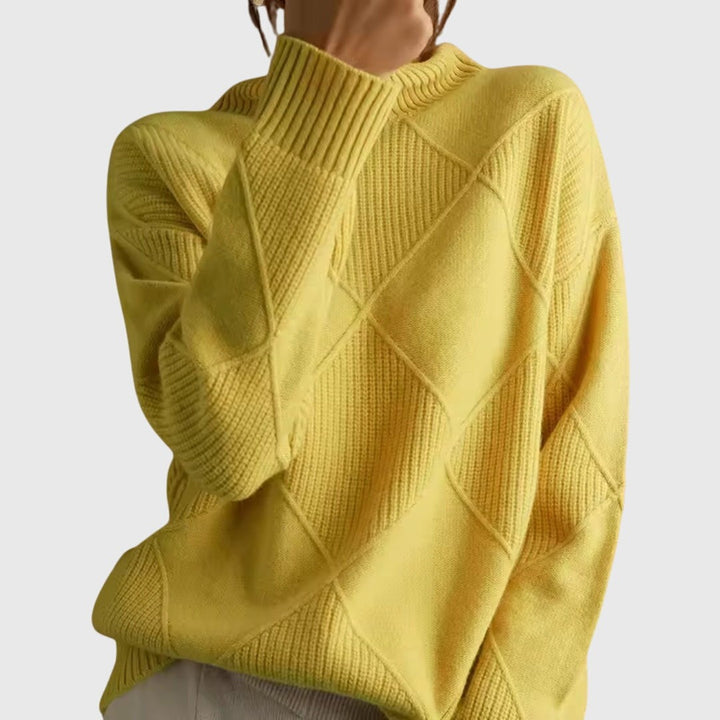 Yellow ribbed mock neck sweater with diamond knit texture, close-up shoulder view