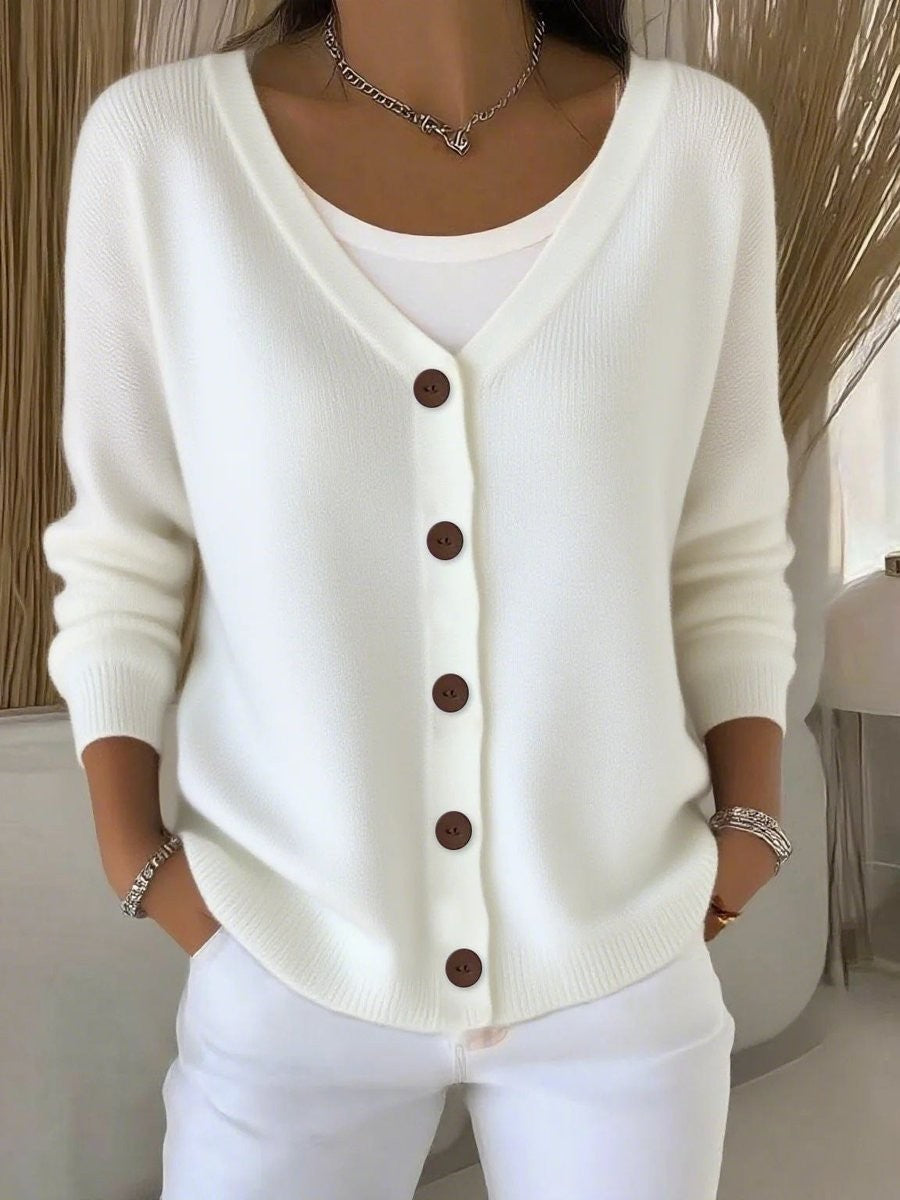 White V-neck button-front knit cardigan sweater with brown buttons