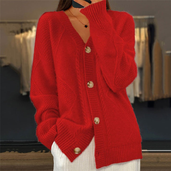 Red cable-knit cardigan with button front and relaxed sleeves