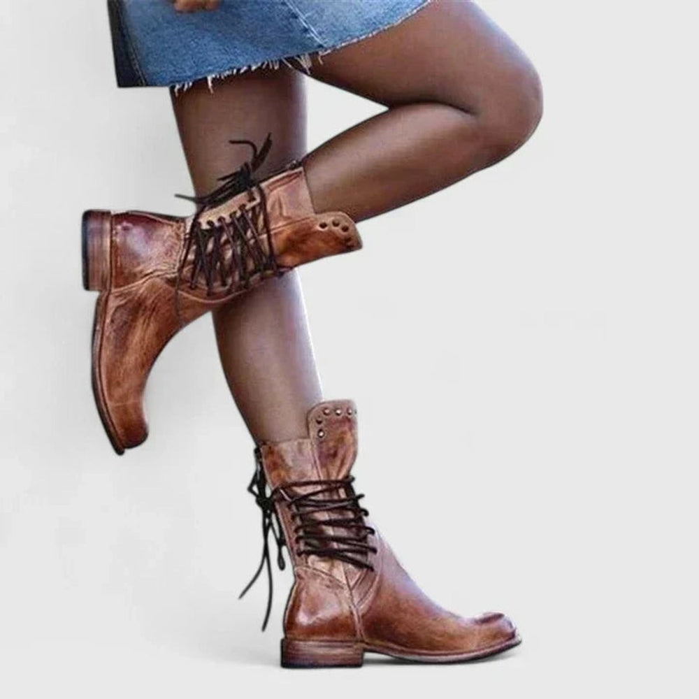 Cognac brown leather knee-high boots with lace-up front and studded detail