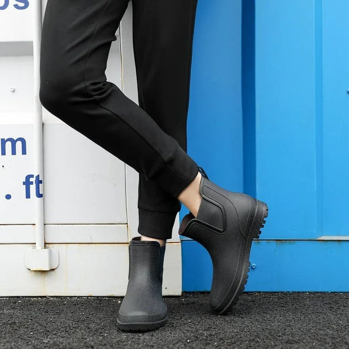 model wearing black waterproof Chelsea ankle boots with platform sole