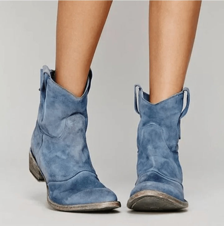 Blue suede western-style ankle boots with distressed block heel