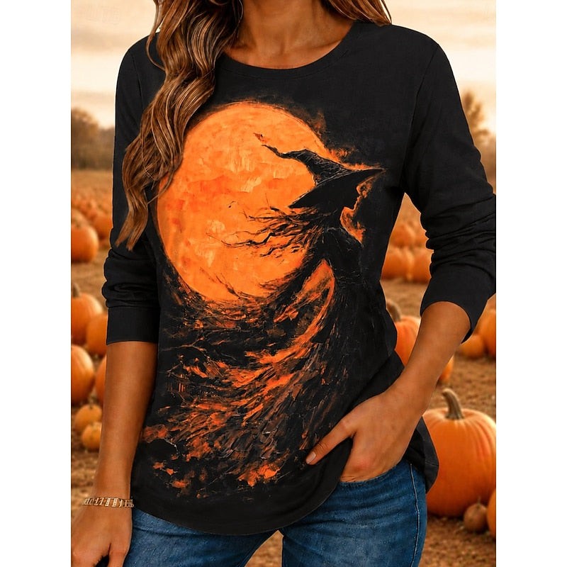 Black long-sleeve top with witch silhouette and orange moon Halloween graphic