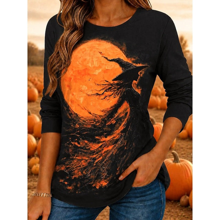 Black long-sleeve top with witch silhouette and orange moon Halloween graphic
