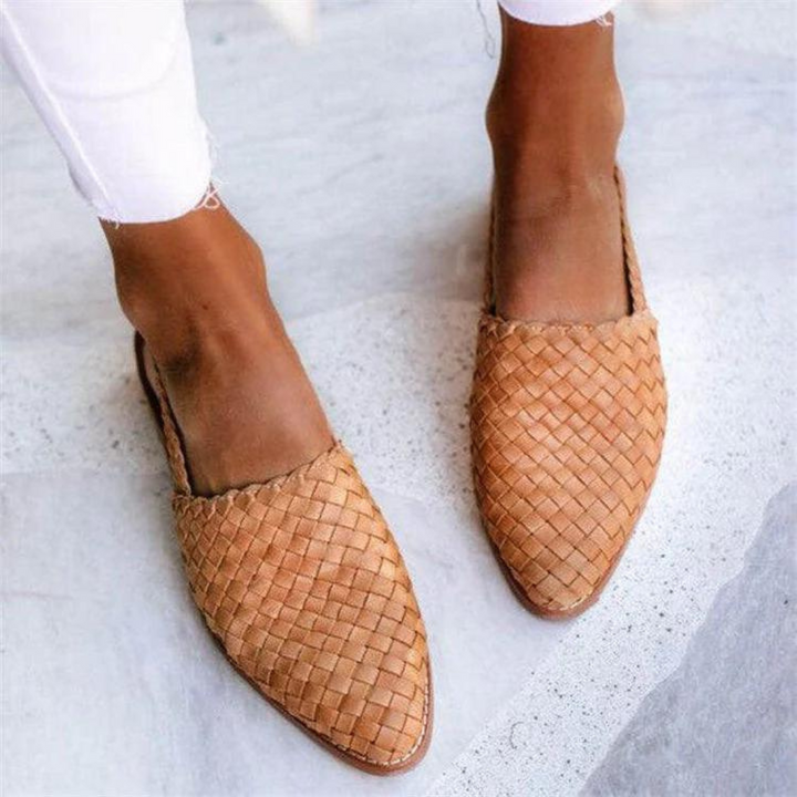 Tan woven vegan leather flats featuring pointed toe and slingback strap