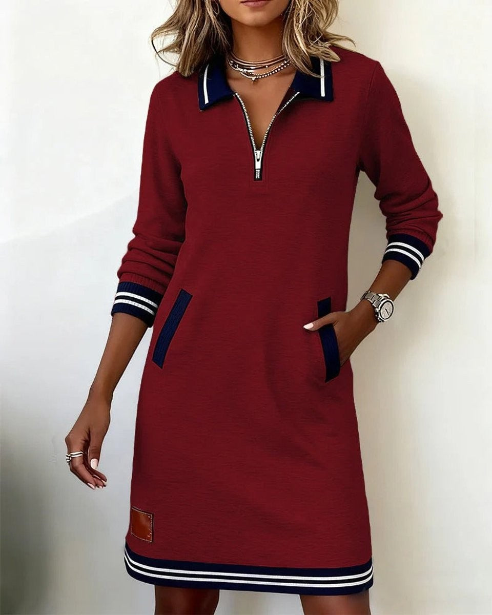 Navy quarter-zip polo dress with striped cuffs and front pockets