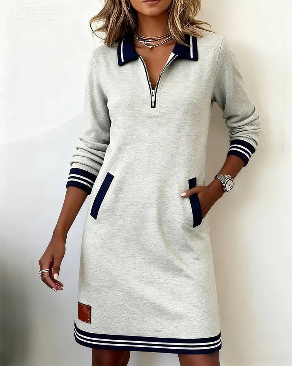 Ivory long sleeve sweater dress with navy collar and striped hem