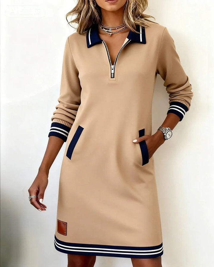 Navy long sleeve polo dress with quarter-zip and striped trim