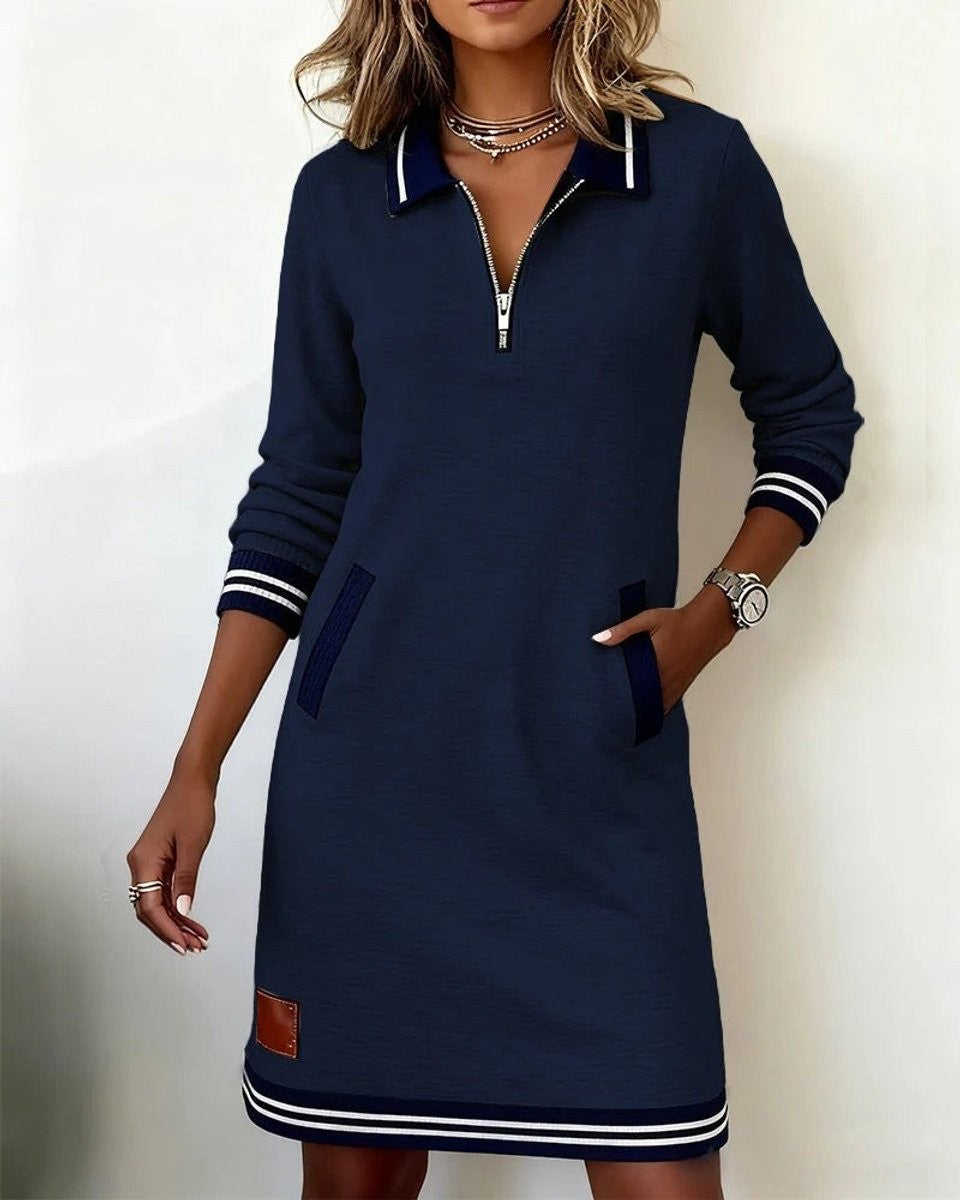 Black zip-up sweater dress with navy striped cuffs and hem