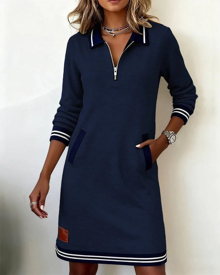 Black zip-up sweater dress with navy striped cuffs and hem