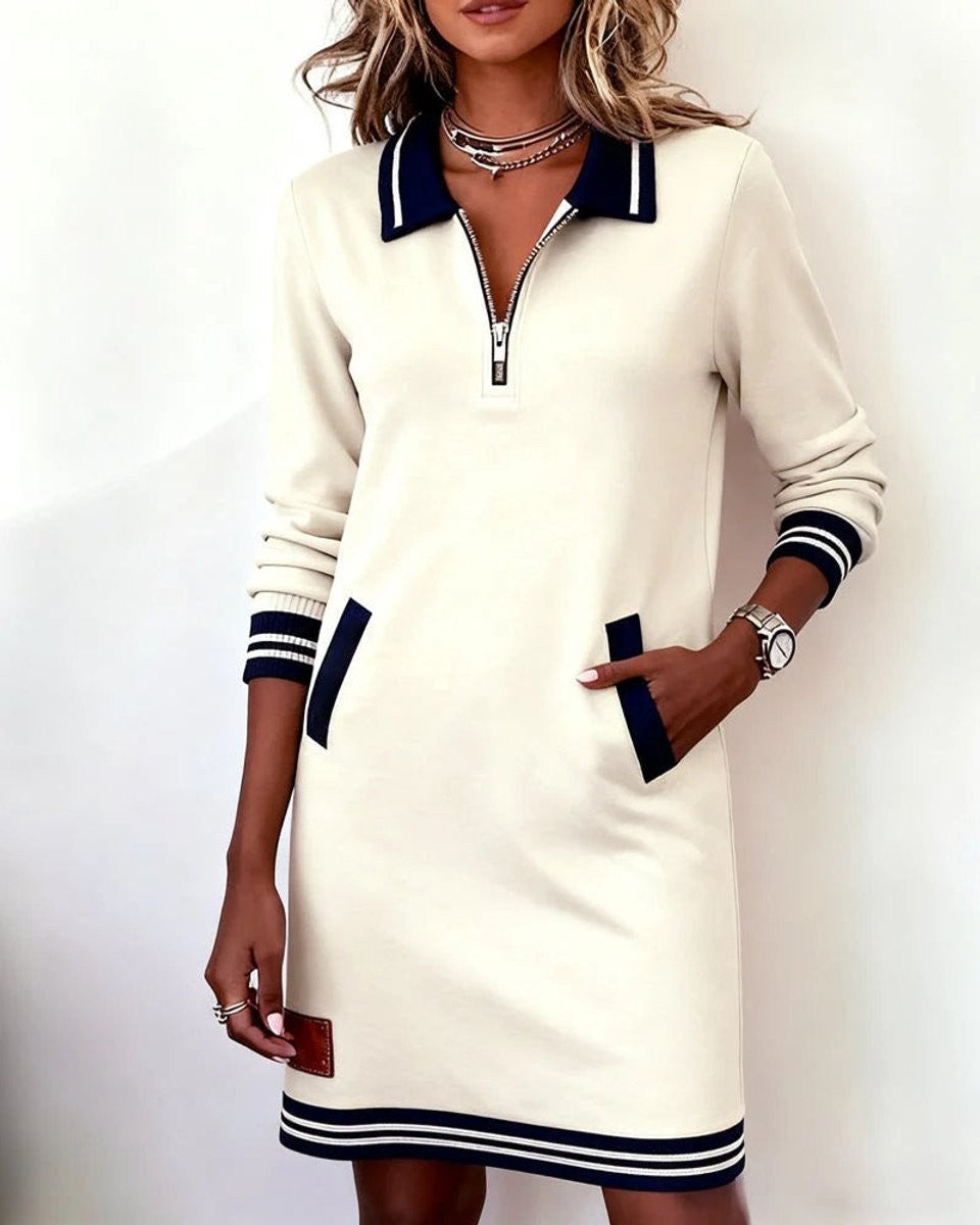 Cream zip-up polo sweater dress with contrast pockets and ribbed hem