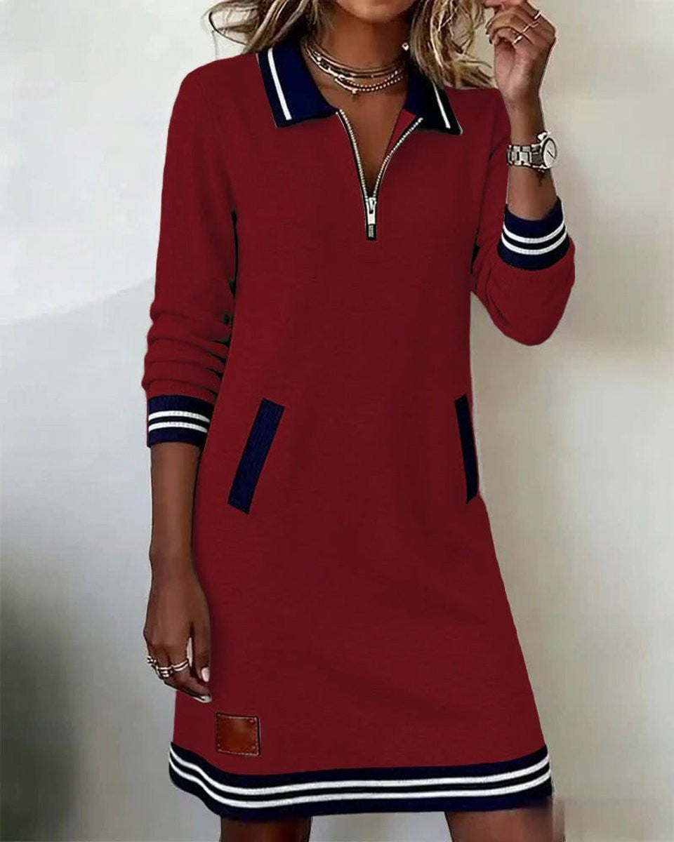 Red long sleeve sweater dress featuring navy collar and striped hem
